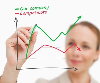 Businesswoman drawing a graph in green and red